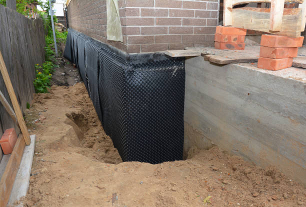 SJ Waterproofing Pros technician performing targeted Basement Waterproofing assessment in Cheltenham, MD